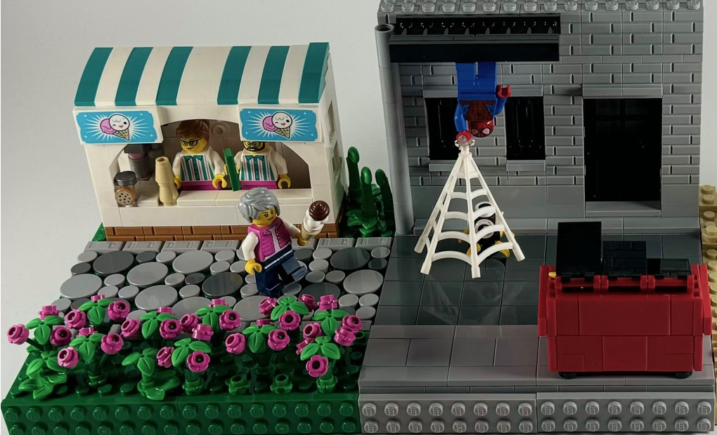 Two MOP modules, one of a minifig enjoying the ice cream they just purchased, and the other of Spiderman hanging upside-down in an alley